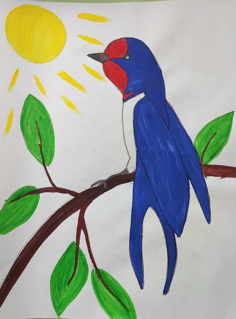 Ласточка в весенних лучах солнца